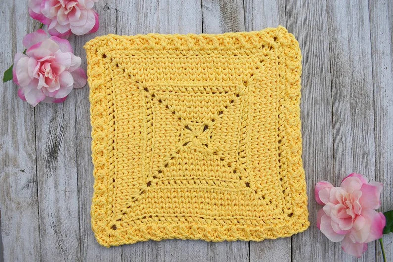 Finished waistcoat stitch crochet dishcloth in cotton yarn showing knit-like texture