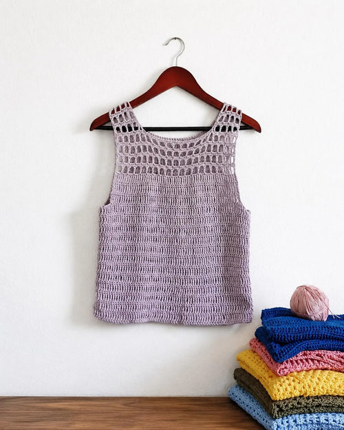 Lavender crochet tank top on hanger, sleeveless with round openwork neckline